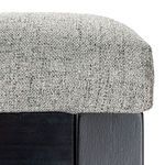 Close-up of light gray textured fabric upholstery on the seat cushion