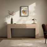 Abaso Console Table styled in room setting with wall art, vase, lamp, rug, and armchair