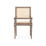 Front view highlighting cane backrest and seat with lacquered wood arm supports and tapered legs