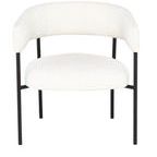 Front view of Cassia chair showing curved backrest and wide, cushioned seat in white boucle fabric