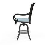Monterey Barstool shown from side, highlighting curved armrest and swivel stool base with footrest