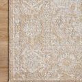 Close-up of corner on wood floor highlighting detailed floral pattern and tightly finished edge