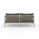 Rear view of Sherwood sofa showing vertical cotton rope weaving and teak frame