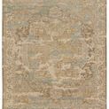 Flat lay of the full rug showing its medallion pattern and faded color treatment