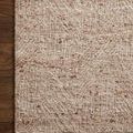Close-up corner of Raven Oatmeal Natural Rug on wooden floor emphasizing texture and geometric weave