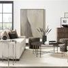 Calliope Cocktail Table styled in living room with white sofa, modern art, and textured rug