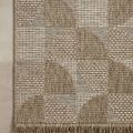 Close-up top view of rug edge with fringe and detailed circular woven pattern