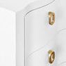 Side angle close-up highlighting soft curves of the drawer fronts and the oval gold handles