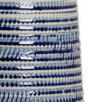 Close-up of cobalt blue and white beehive texture on the porcelain lamp body