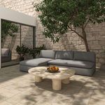 Dark gray Miles outdoor sectional sofa viewed from right side on patio, next to glass sliding door.