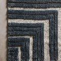 Top-down view of Hagen rug corner highlighting plush texture and sharp geometric design