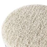 Detailed close-up showing looped knit texture of boucle-like seat fabric