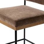Close-up detail of thick seat cushion with brown fabric and oak wood base edge