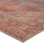 Close-up on corner showing detailed floral border and vintage distressed texture