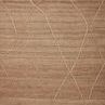 Natural jute rug with a tonal Moroccan-inspired design featuring linear and braided details