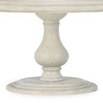 Close-up of the rounded pedestal base showing detailed wood grain and layered circular platform