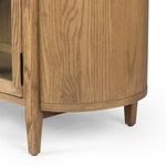 Close-up of glass door hinge mounted to tapered wooden leg and sideboard frame
