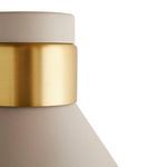 Close-up of brass band and taupe finish at top of shade