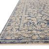 Low-angle side view showing rug’s texture, edges, and delicate fringe detailing