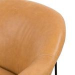 Detailed view of smooth leather side with subtle stitching on the armrest