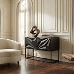 Zurich Console placed in bright classic interior beside curved white sofa featuring decorative sculpture and books