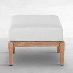 Reverse angle of teak ottoman with white cushion showing clean lines and wood color