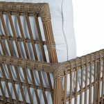 Close-up of top corner of woven armrest and edge detailing of cushion back