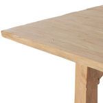 Diagonal close-up of table edge displaying smooth finish and light wood tone