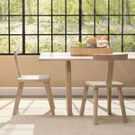 Two Parlor Mango Wood Chairs at a dining table in front of large window with forest view