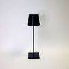 Back view of the Vera Black Poldina Pro Table Lamp showing straight pole and square base