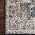Macro close-up of Teagan Denim Pebble Rug pile showing detailed floral patterns and colors