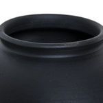 Close-up focused on the rolled lip rim of the vase, highlighting smooth finish