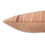 Side view of lumbar pillow showing detailed texture of blush cotton weave and embroidery accents