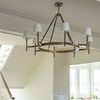 Katie Large Chandelier in bright room near staircase and kitchen visible in background