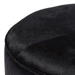 Close-up focusing on finely stitched edges and dense hair-on hide surface