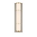 Lit Blaine Wall Sconce centered on polished nickel backplate with brass rings accentuating glass