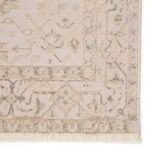 Macro shot of detailed medallion pattern and looped pile texture near rug corner