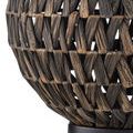 Casimer Black Table Lamp lit on patterned green wallpapered background with decorative wood cabinet