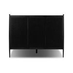 Back panel of the Xander Upholstered Bed featuring solid black iron upholstery backing with rivet details
