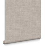 Partial roll of Rustic Weft Wallpaper showing detailed texture and cream color against white background
