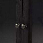 Close-up of small round metal knobs on Spencer Curio Cabinet doors
