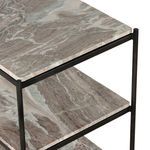 Close-up corner view showing junction of hammered iron frame and marble shelves