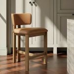 Morel Counter Stool in kitchen setting on wood floor next to gray cabinetry and island