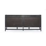 Rear view of sideboard with two large black panels featuring cord management cutouts