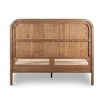 Back of headboard showing horizontal supporting rail and slatted bed frame in natural wood