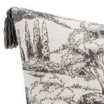 Close-up of textured cotton linen fabric in black and white toile design with corner tassel detail