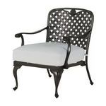 Three-quarter front angle of chair showing light grey cushions and classic ornate cast aluminum frame