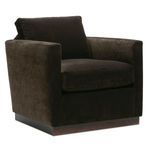Angled front-left view showcasing the chair’s boxy arms and dark soft fabric upholstery
