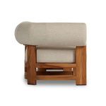 Side view focusing on teak leg structure supporting seat and backrest