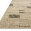 Angled close-up showing soft texture and edge detail of taupe Bowery Slate rug